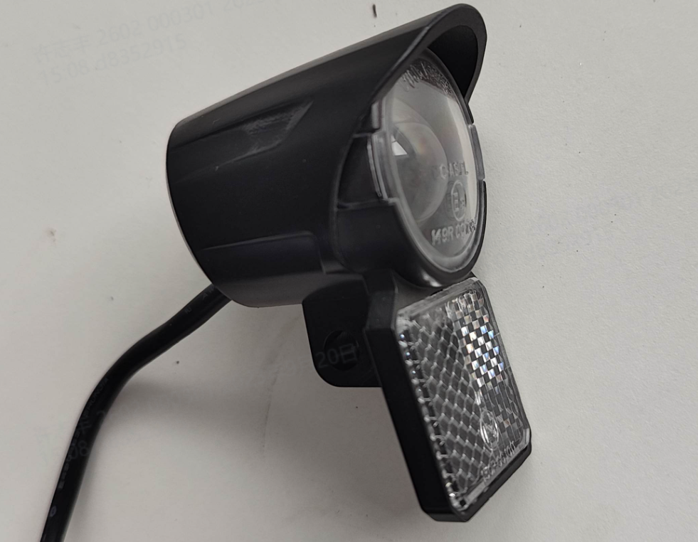 Headlight and front reflector assembly